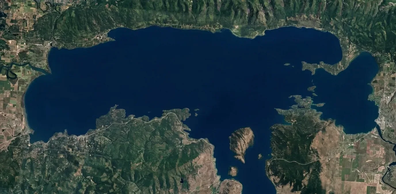 Calm blue lake surface at dusk